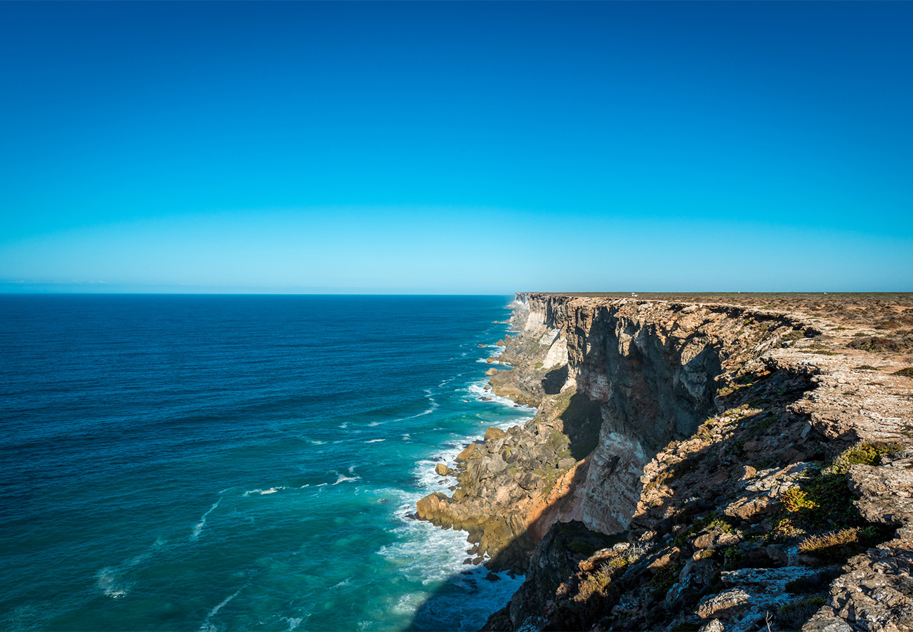 Dramatic coastal cliffs in Australia's Golden Outback with turquoise ocean waters