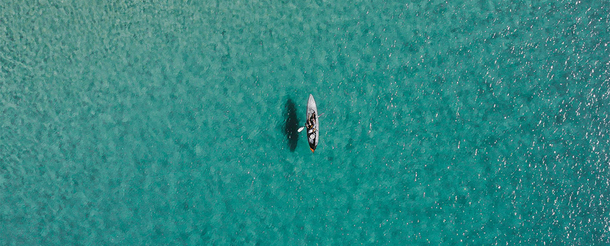 Aerial view of kayaking in crystal clear turquoise waters of Margaret River