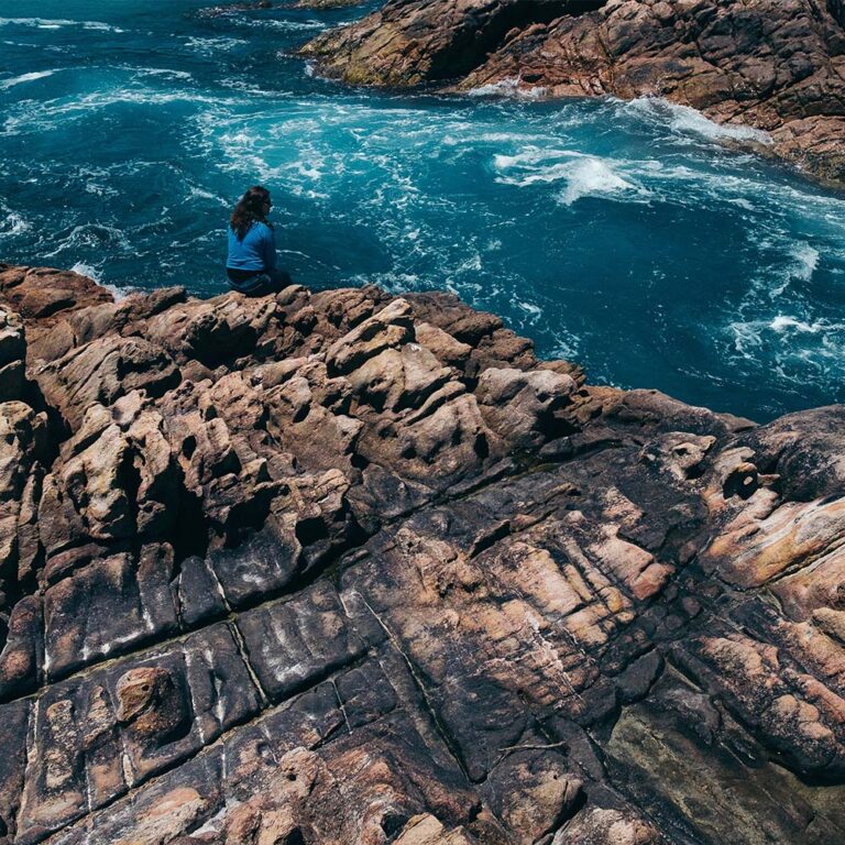 Dramatic rocky coastline in Margaret River with deep blue waters