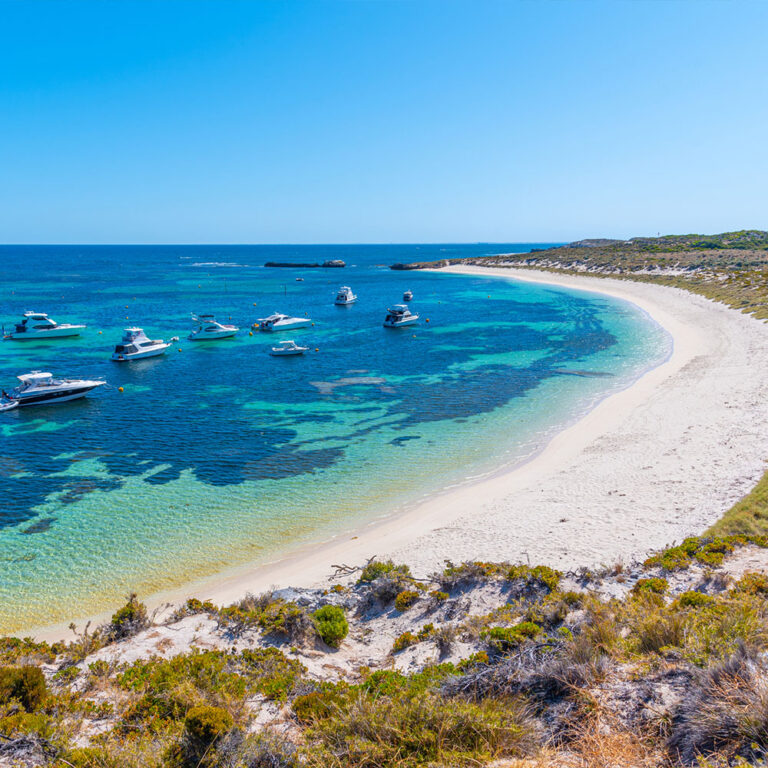 Boats moored at Catherine Bay on Rottnest Island with pristine waters